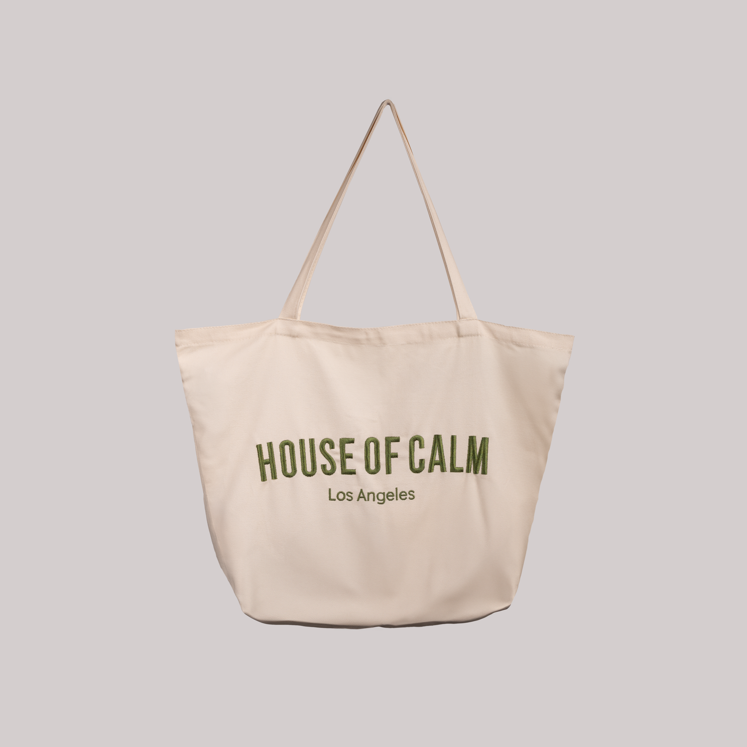 Minimalist sustainable cotton tote bag on white background